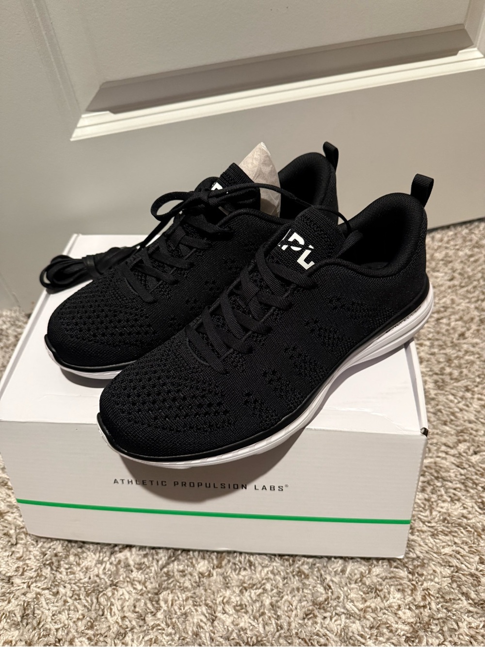 APL Women's TechLoom Knit Sneaker in Black and White